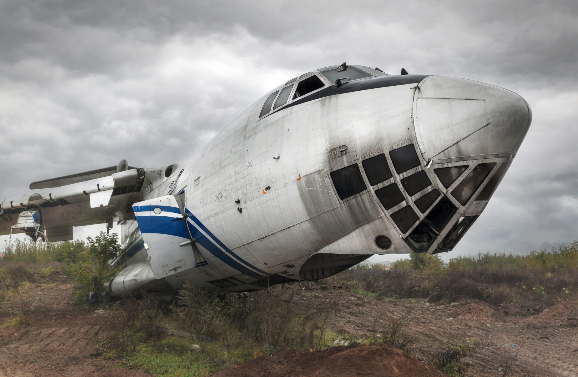 Old Soviet cargo plane IL-76 on the ground in cloudy weather. High quality photo