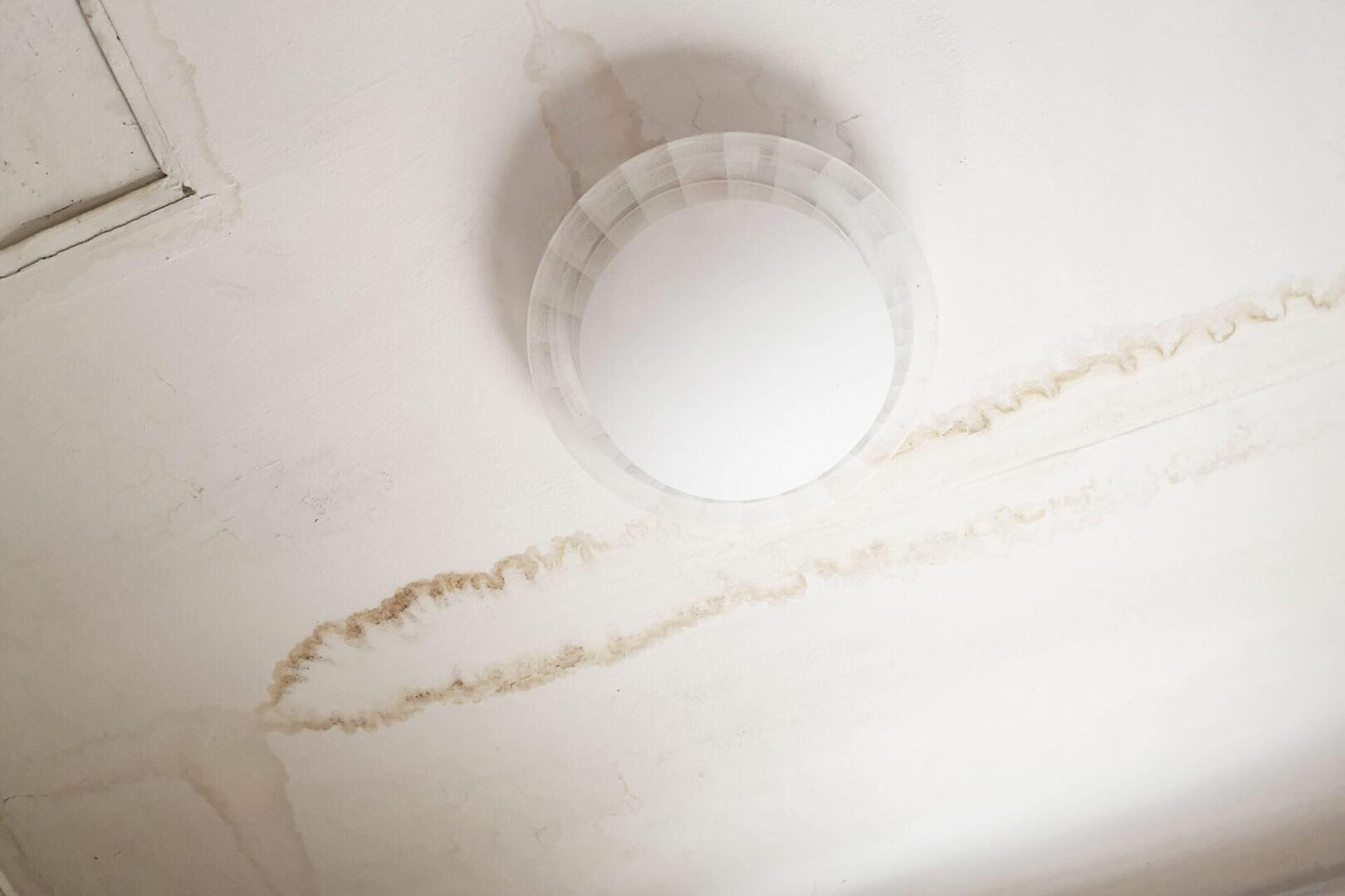 Rain water leaks on the ceiling causing damage, tiles and gypsum board.Dangerous if an electric shock occurs.